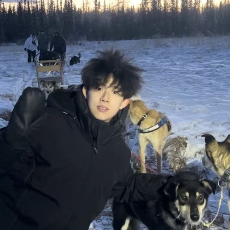 Eric with sled dogs in the snow